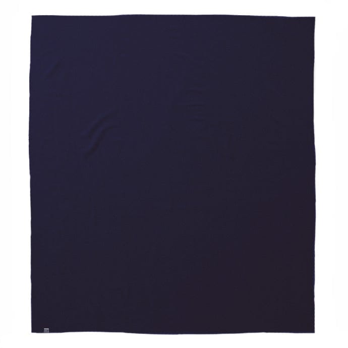 Faribault Mill Pure and Simple navy middleweight wool bed blanket, unfolded and laid flat in a top-down view.