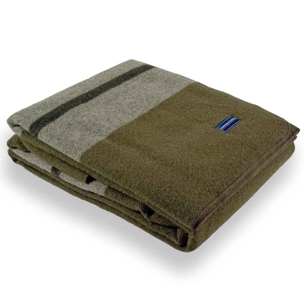 Faribault Mill Scout moss green middleweight wool bed blanket, folded and displayed at an angle to highlight the thickness, loft of the wool, and serged edges.