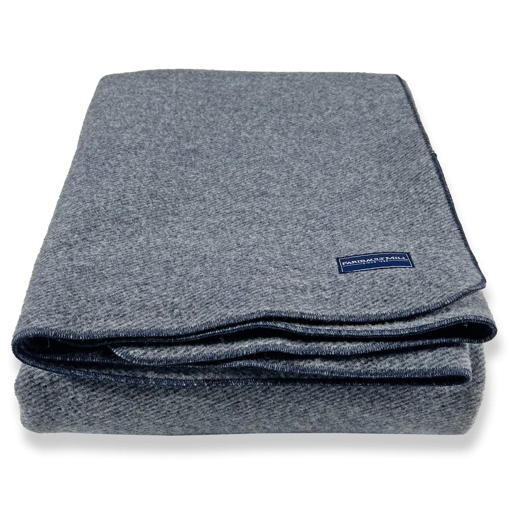 Faribault Mill Summit navy heavyweight wool bed blanket, folded and displayed from the front showing the weave and texture.
