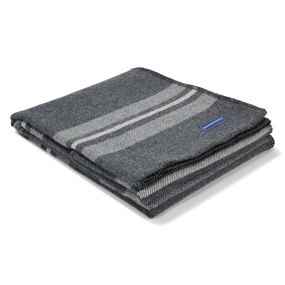Faribault Mill Cabin charcoal middleweight wool throw, folded and displayed at an angle to highlight the thickness, loft of the wool, and whipstitched edges.
