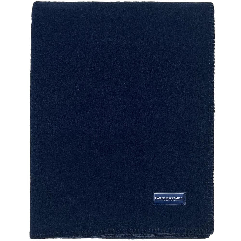 Faribault Mill Pure and Simple navy middleweight wool bed blanket, folded and displayed in a top-down view.